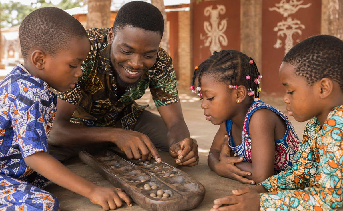Jeunes réunis autour de jeux de société à Ouidah
